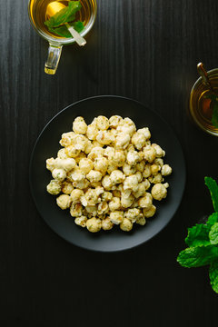 Peppermint and white chocolate popcorn with peppermint tea