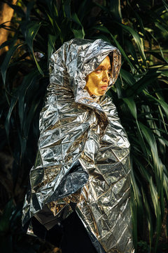 Woman?s face covered by gold glitter