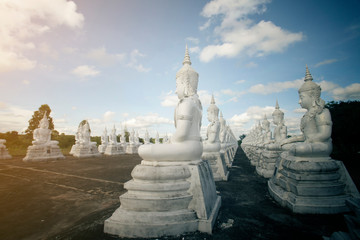 Fototapeta na wymiar Row white buddha statue with blue sky