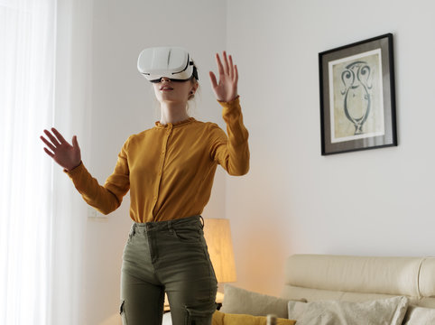 Woman in VR headset exploring another worl