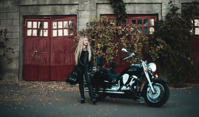 Beautiful woman on motorcycle outdoor. 
