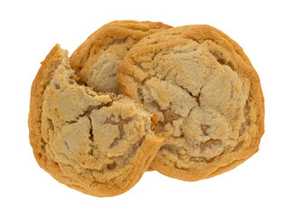 Top view of a broken cookie filled with cookie butter atop two whole cookies isolated on a white background.