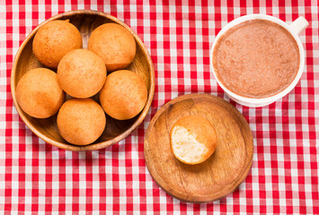 Traditional Colombian buñuelo - Hot chocolate drink