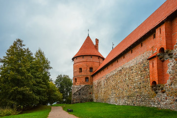 Fototapeta na wymiar Ancient castle on island in middle of lake. Trakai Island Castle historical landmark, Lithuania.
