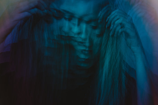 Blue multiple image of young woman