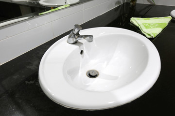 Sink and faucet decoration in bathroom interior