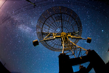 Radio telescopes and the Milky Way at night