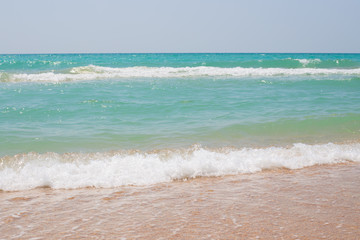 azure seashore with waves