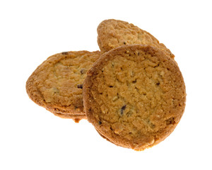 Group of three cranberry and oat cookies isolated on a white background.