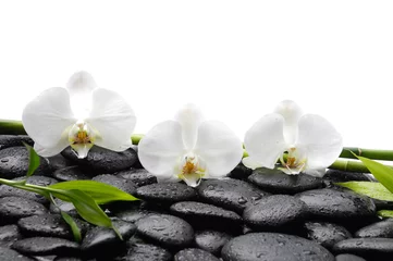 Rolgordijnen spa concept –three white orchid and bamboo grove , wet stones © Mee Ting