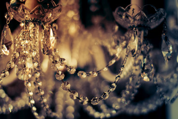 abstract image background of blur bokeh and crystal chandelier light equipment filter tone color...