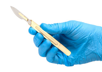 Scalpel in the hands of doctor in gloves isolated on white background. Surgeon with knife before surgery