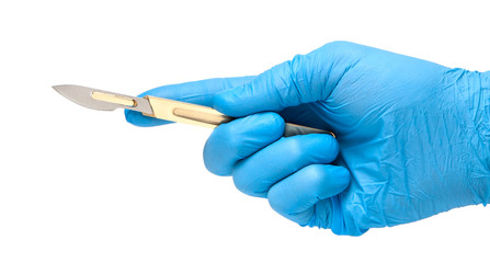 Scalpel in the hands of doctor in gloves isolated on white background. Surgeon with knife before surgery