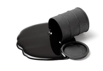 Oil spilled from black barrel isolated on white background.