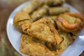 Close up of deep fried dumplings on a plate