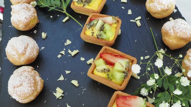 Tasty mix of fruit pastries and mini krapfen