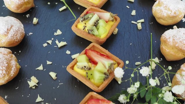 Tasty mix of fruit pastries and mini krapfen