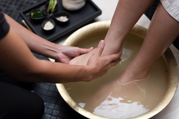 Foot washing in spa before treatment