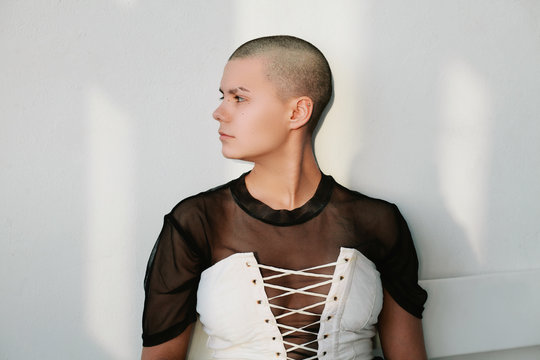 Studio portrait of bald woman