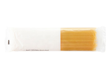 Raw spaghetti in plastic bag  isolated on white