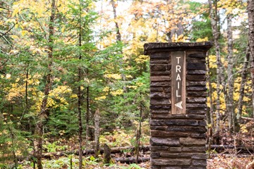 Fototapeta na wymiar trailhead sign along the North County Trail or NCT in Upper Peninsula Michigan in Autumn