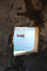 window to galleon on the sea