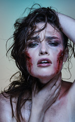 Beautiful girl with a wounded face in the blood - 229296073