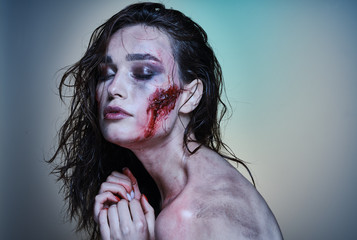 Beautiful girl with a wounded face in the blood - 229296212