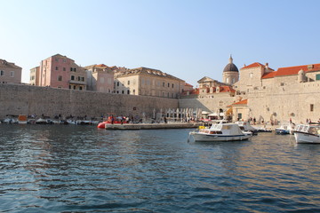 Fototapeta na wymiar Ancient city of Dubrovnik port and boats