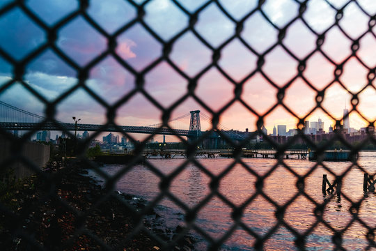 Williamsburg Bridge behind a Fance. New york City