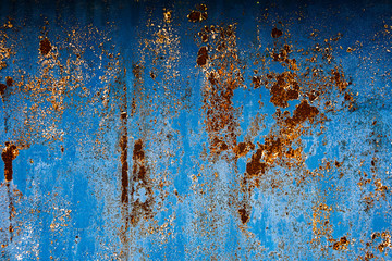 Blue textured surface with corrosion