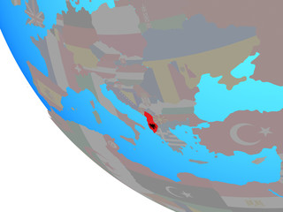 Albania with national flag on simple globe.