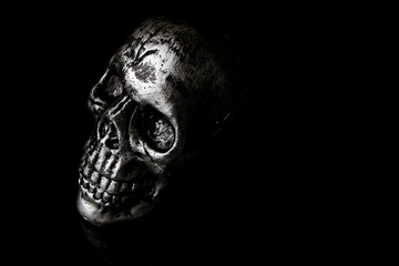 Human skull Halloween dark scary horror story ideas concept isolated on black background