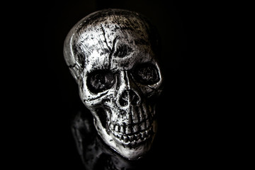 Human skull Halloween dark scary horror story ideas concept isolated on black background