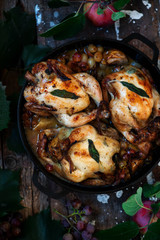 Roasted  cornish hens with grapes and apples.