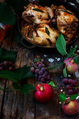 Roasted  cornish hens with grapes and apples.