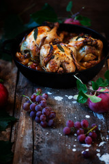 Fototapeta na wymiar Roasted cornish hens with grapes and apples.