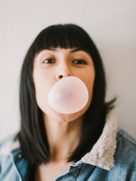 Woman blowing a bubble
