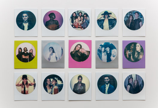 Round polaroid prints arranged in three rows of five.