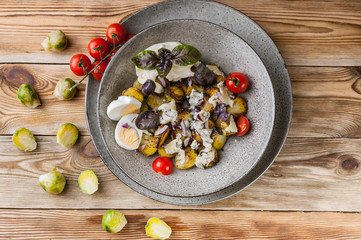 Roasted Brussels sprouts with cheese Dor Blue, egg and red onion. Top view