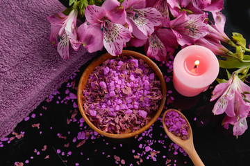 Obraz na płótnie Canvas Spa background-towel, pink orchid, and spoon ,petals in bowl, candle