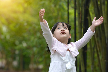 Fototapeta na wymiar little malay muslim girl playing outdoor