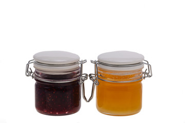 jar of jam and honey on white background