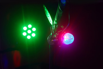Stage lights in action at the concert. Lights show. Lazer show. Night club dj party people enjoy of...