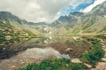 Naklejka na ściany i meble Picturesque lake with crystal clear water in High Tatras Slovakia