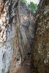 A narrow canyon with two steep, tall and huge limestone faces which is a popular rock climbing site in Vang Vieng, Laos.