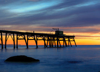 old wooden pier at sunset