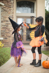 Two little girls having fun on Halloween