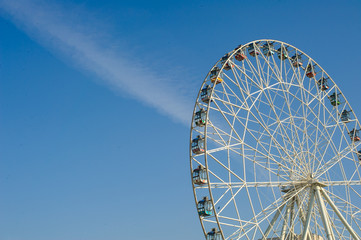 ferris wheel against a blue sky