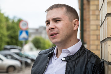 Portrait of handsome young man on the street